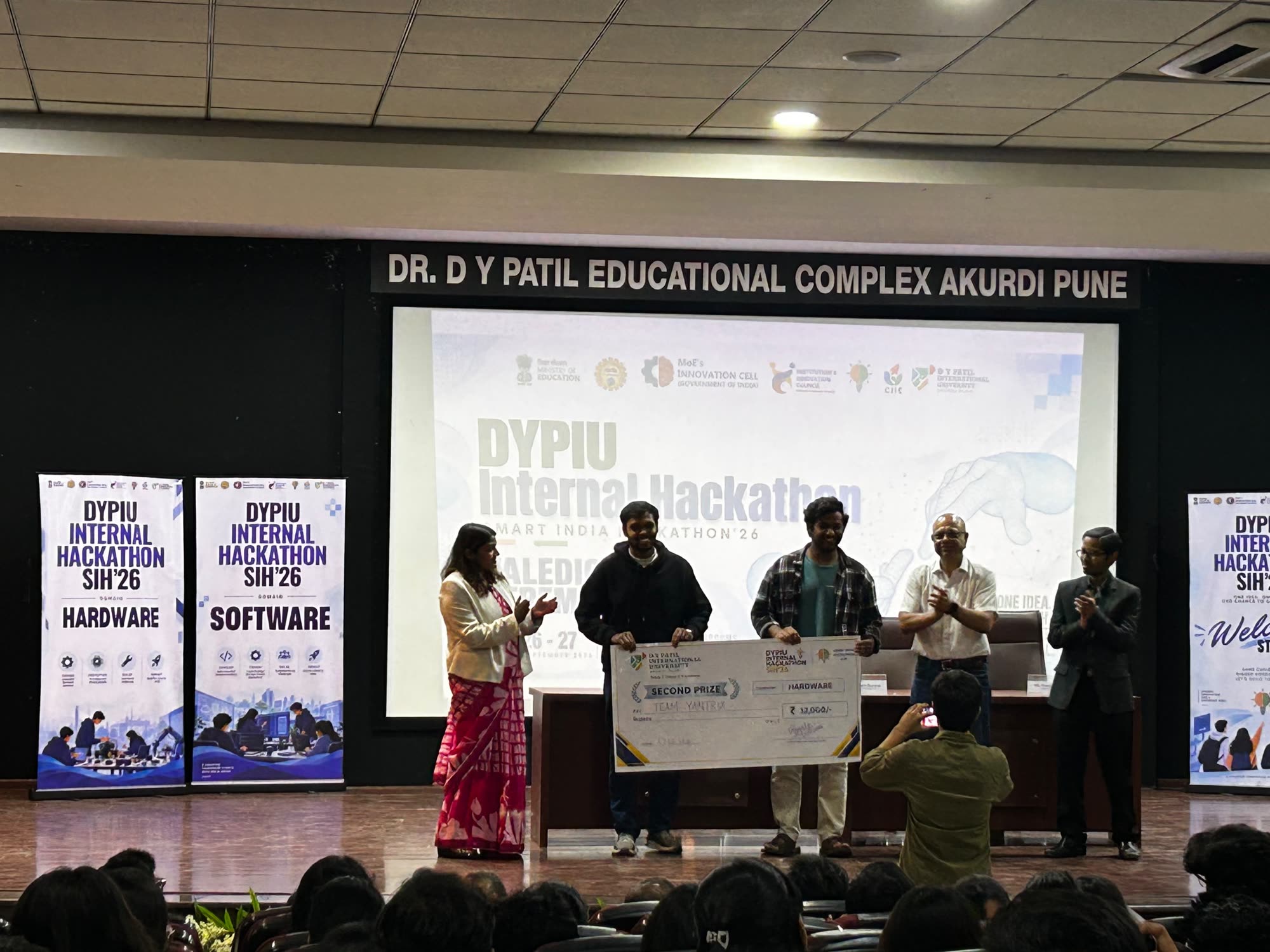 Team Yantrix receiving the second prize cheque for Hardware at the DYPIU Internal Hackathon